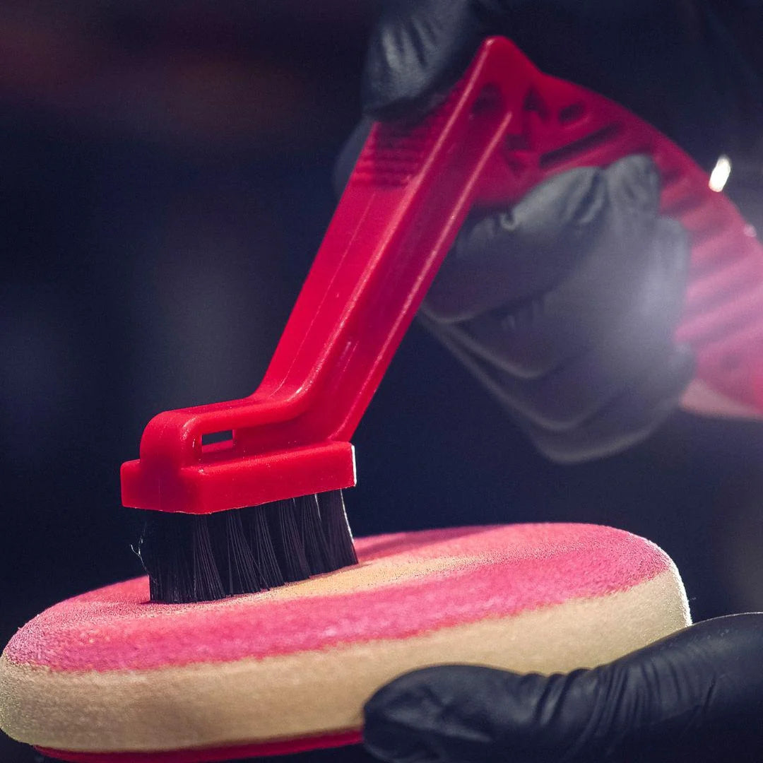 Pad conditioning and cleaning brush