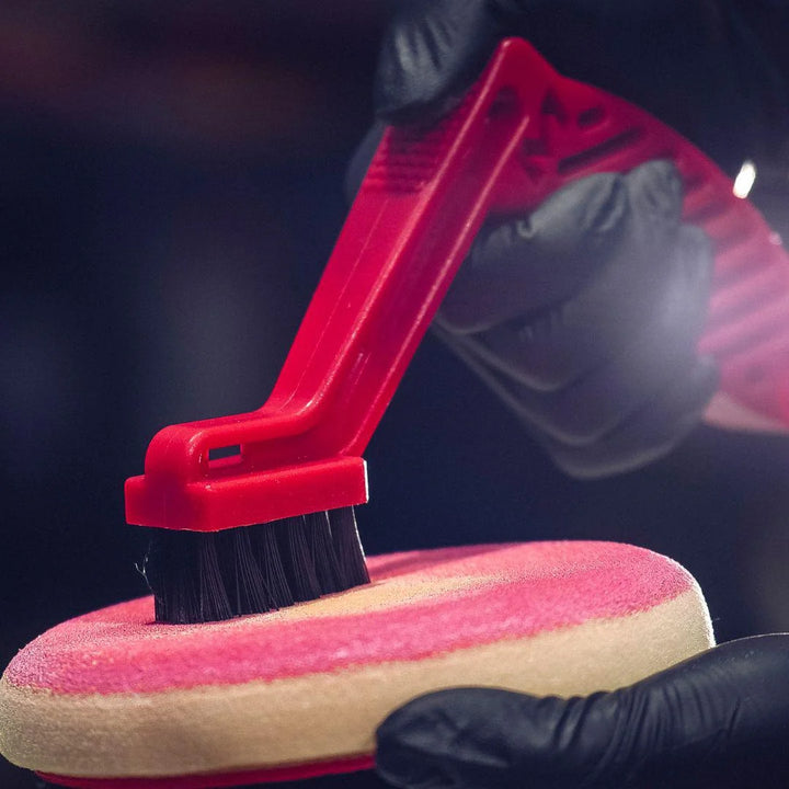 Pad conditioning and cleaning brush